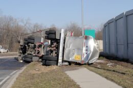 Overturned tanker truck lying on its side